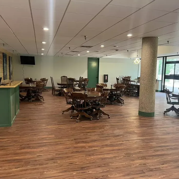 Bright, modern dining room at Rice's Café with wood tables and natural light